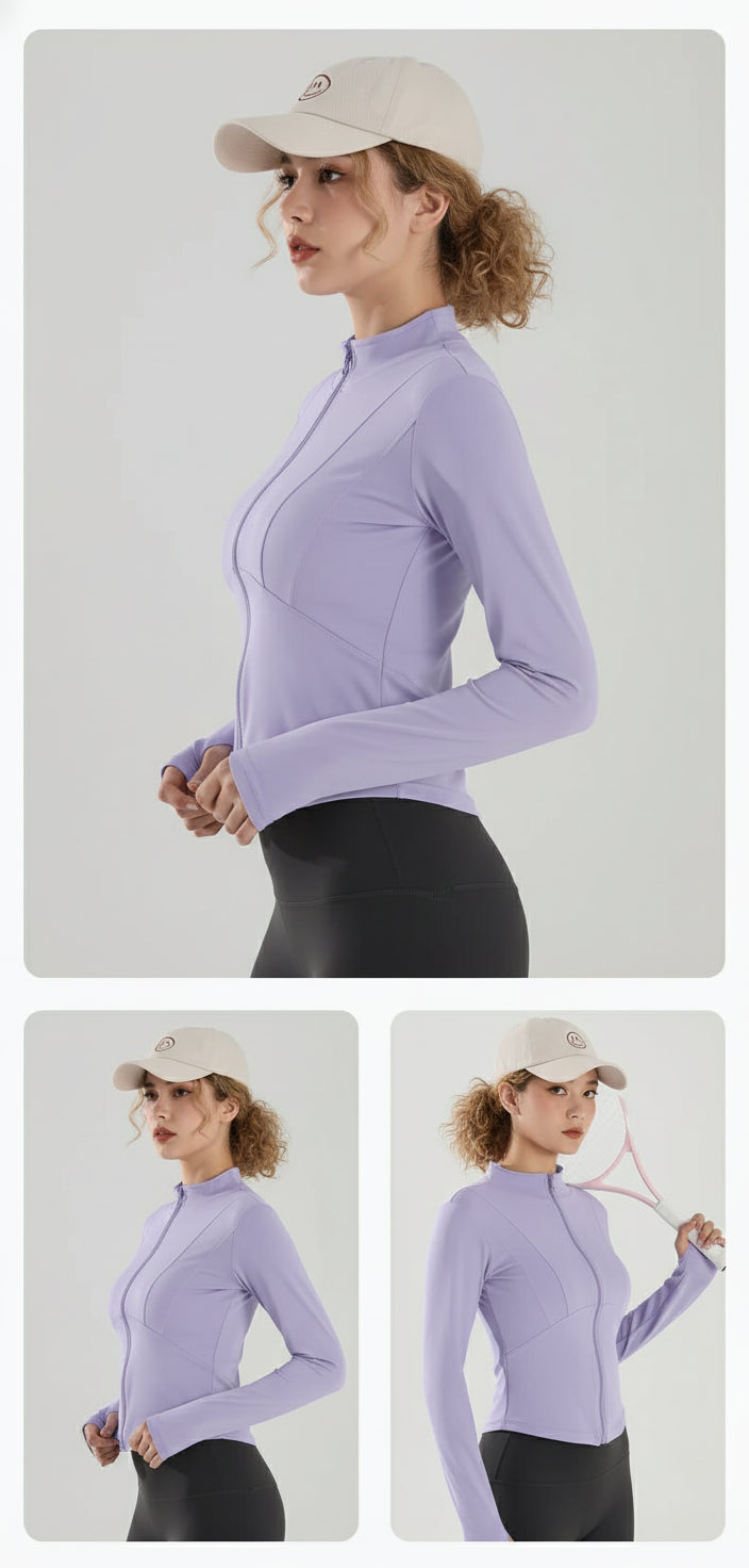 Woman wearing a light purple long-sleeve athletic jacket and cap on a white background