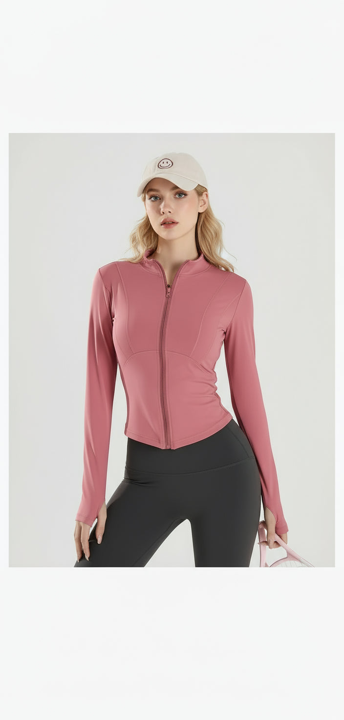 Woman wearing a pink zip-up jacket with a white cap on a white background