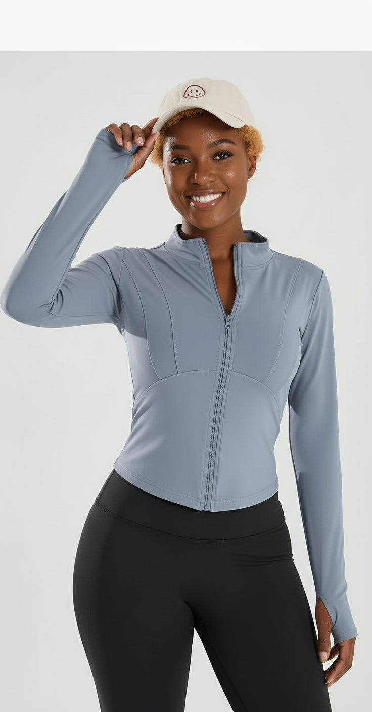 Woman wearing a light blue athletic jacket and cap, with 'Yoga Clothes' text on the left.