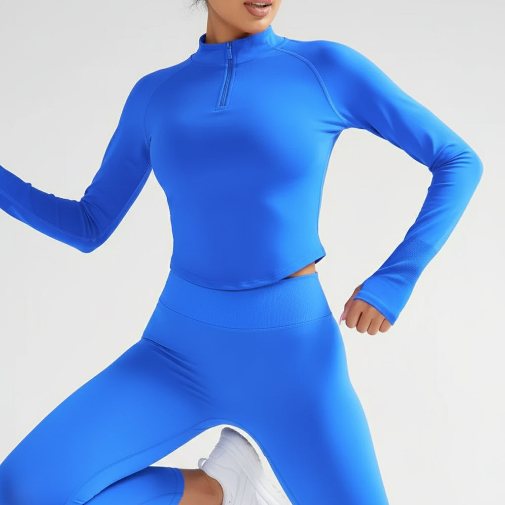 Blue cropped slim-fit top with text on a white background